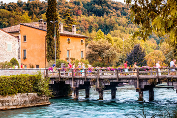 Canvas Print - Waters and ancient buildings of Italian medieval village