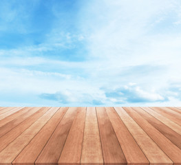 Wall Mural - Wood table top on blue sky with clouds - used for display your products