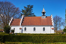 The South Facade Of A Small Danish Chapel Lying Between The Graves