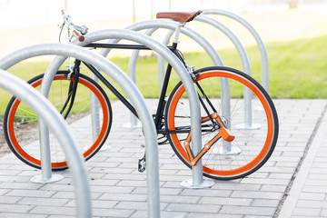 close up of bicycle locked at street parking