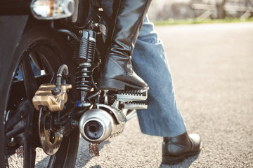 Couple sitting over motorcycle ready to go