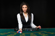 © nazarovsergey - The beautiful girl, dealer, behind a table for poker