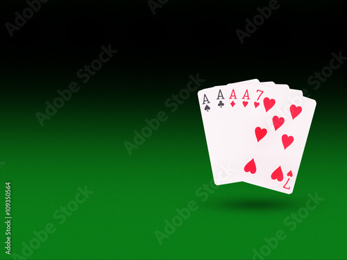 фотография Four of a Kind playing cards on the poker table