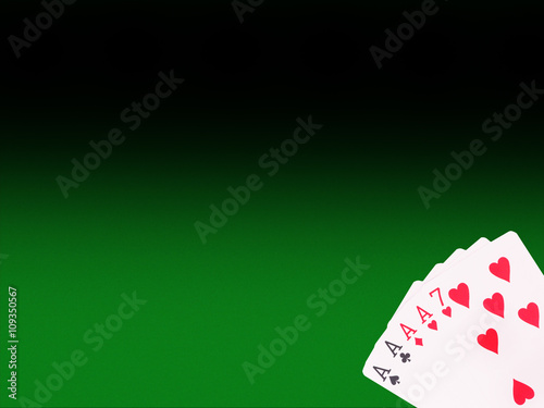 Four of a Kind playing cards on the poker table плакат