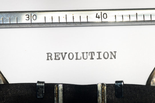 word revolution typed on  typewriter