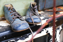 Old And Dirty Blue Shoes With Shoelaces