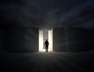 Wall Mural - man entering a mysterious maze