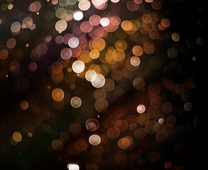 Wall Mural - glittering bokeh light on dark background
