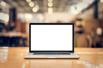 Laptop with blank screen on table - whole laptop is sharp.