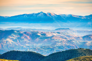 Wall Mural - blue mountains and hills at sunset
