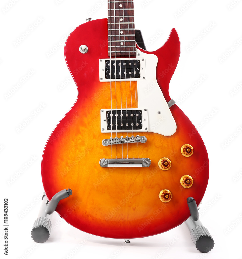 Electric guitar on a stand, isolated on white