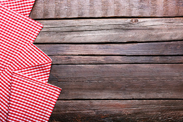 Wall Mural - Checkered napkin on wooden background