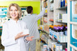 © JackF - female pharmacist   posing in drugstore