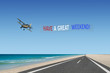 © Jay Koppelman - have a great weekend plane banner in american flag colors of red white and blue flying over road at beach