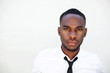 © mimagephotos - Serious young african man in shirt and tie