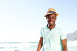 © mimagephotos - Cool young african man with hat at the beach
