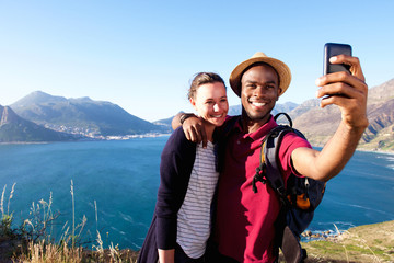 Wall Mural - Loving young couple on holiday taking selfie