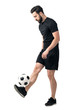 © sharplaninac - Side view of freestyle soccer or futsal player juggling ball with his legs. Full body length portrait isolated over white background.