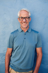 Wall Mural - Handsome mature man smiling at camera