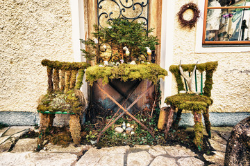 Two chair and table covered with moss