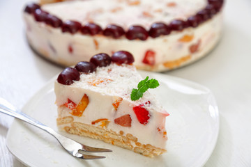 Wall Mural - Cake with strawberries, gelly yogurt and cherries isolated on white background in a plate