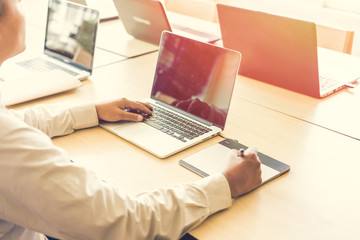 Leinwandbilder - Graphic designer using graphics tablet and computer laptop in th