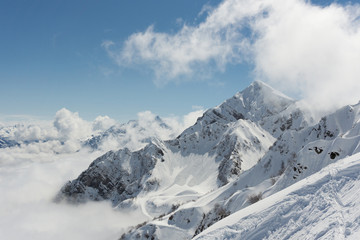 Winter mountain landscape and cloudy sky.