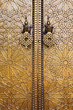Morocco. The Royal Palace of Fez (Dar el Makhzen). Door details with a giant brass knockers