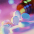 © Connect Images - Pain killer pills spilling out of a bottle