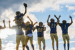 © Connect Images - Group of young american football players, celebrating