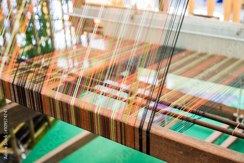 Fotografie, Obraz Detail of weaving loom for homemade silk or textile production