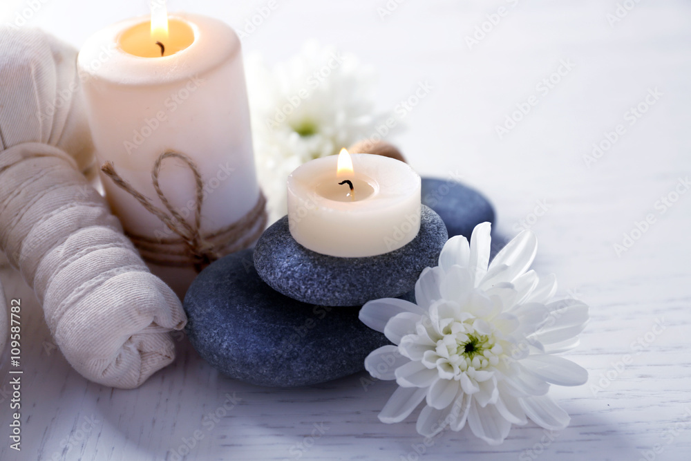 Beautiful composition of spa treatment on a white wooden table
