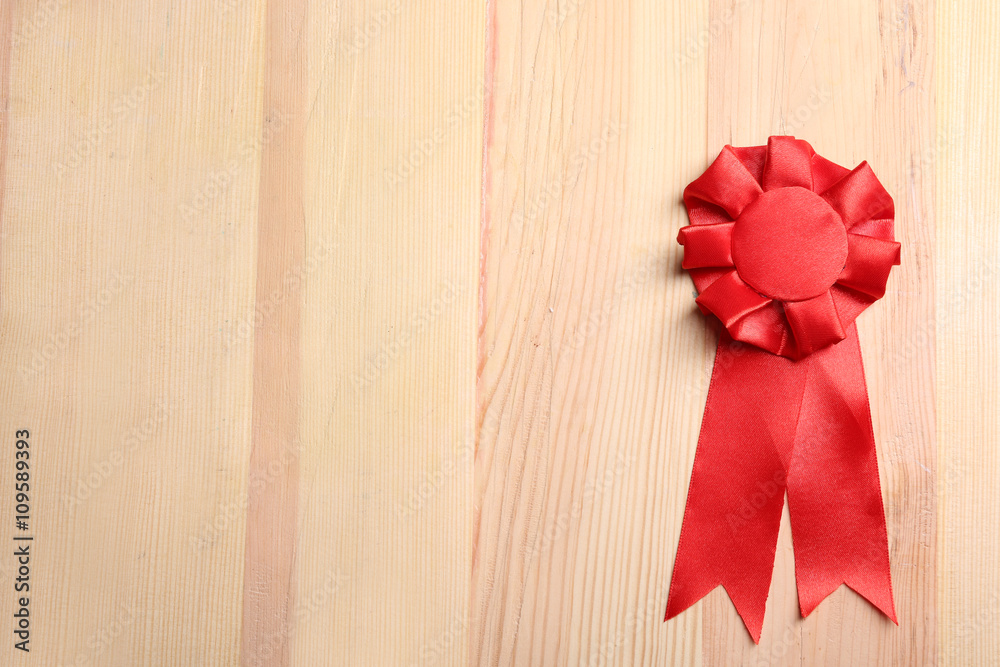 Award ribbon on wooden background