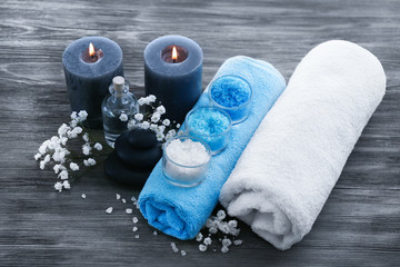 Poster - Spa still life with flowers and candlelight on wooden background