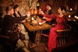 © Nejron Photo - Medieval people eat and drink in ancient castle tavern.