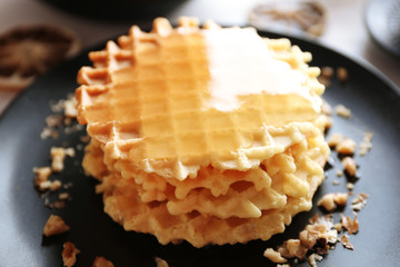 Wall Mural - Fresh tasty waffles with honey, closeup