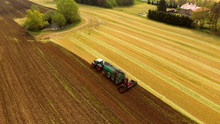 Tractor With Liquid Manure Spreader On Field - Aerial View 