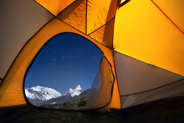 Wall Mural - view of the mountains from a tourist tent. from the «window» from left to right there are two eight-
