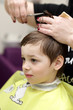 © Arkady Chubykin - Serious boy at the barbershop