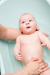 Canvas Print - Baby girl taking a bath