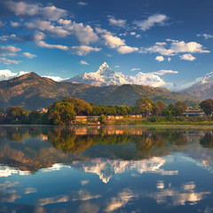 Wall Mural - panoramic view from the lakeside at the foothills of the magnificent mountain range.