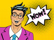 Wow pop art man. Young surprised man in glasses with open mouth.