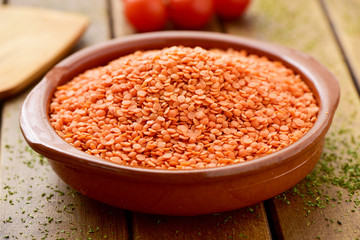 Sticker - uncooked red lentils in an earthenware bowl