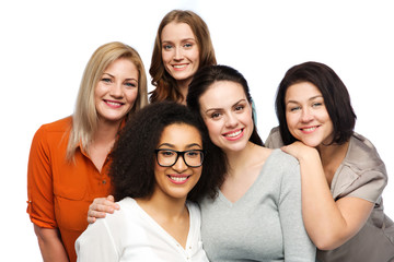 group of happy different women in casual clothes