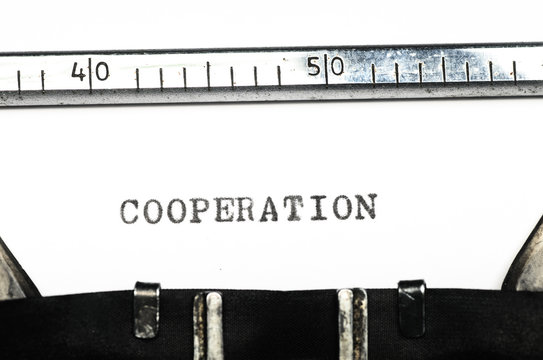 word cooperation  typed on  typewriter
