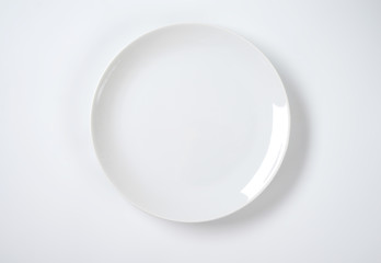 coup shaped white plate