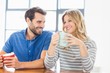 © WavebreakmediaMicro - Young couple holding coffee mug