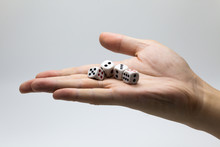 Human Hand Ready To Roll The Dice On White Isolated Background - Try Luck, Take Risk Or Business Concept (Focus On Dices)