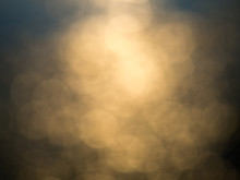 Abstract Photo Of Backlight Reflector And Glitter Bokeh Lights Background. Image Is Blurred And Made With Colorful Filters.