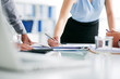 © DragonImages - Cropped image of business lady conducting meeting with coworkers